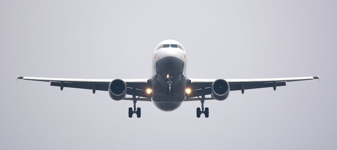 front view of a commercial airplane flying