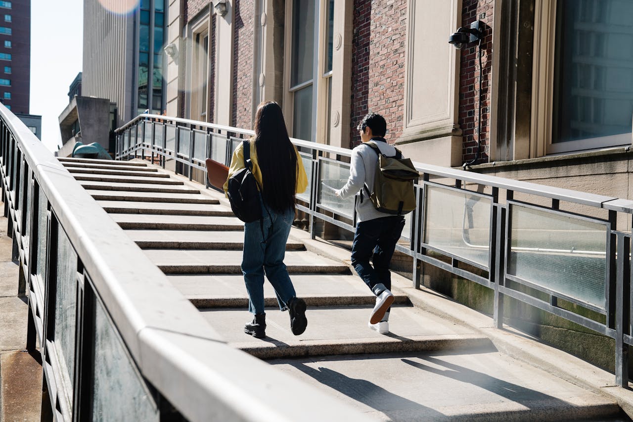 college students walking up stairs